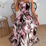 Woman wearing a patterned dress sitting on a chair indoors.
