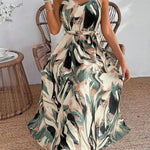 Woman wearing a floral dress sitting on a wicker chair indoors.