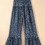 Blue leopard print pants on a beige background