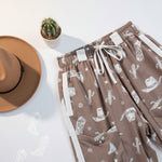 Brown skirt with white patterns on a light blue background