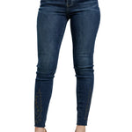 Blue jeans worn by a person on a light gray background