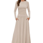 Beige long-sleeve dress worn by a model on a light gray background